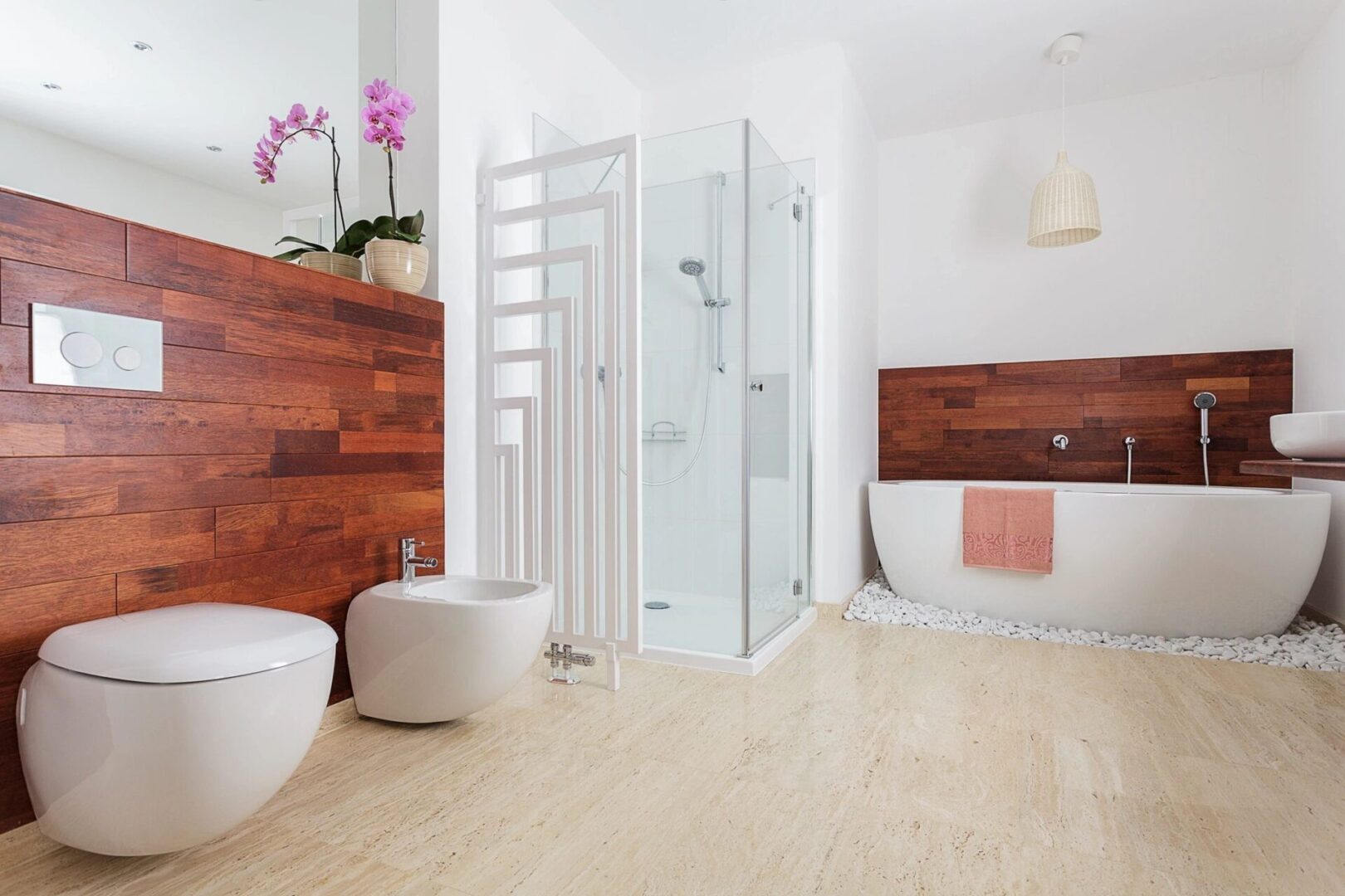 About London Kitchen and Bath - A white and wood bathroom with a tub and toilet.